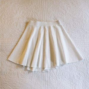 Indah Sail Solid Tennis Skirt in Chalk White (Pleated) size 0